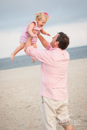 Father tossing daughter